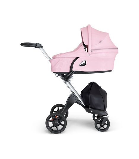 Stokke® Xplory® wtih Silver Chassis and Leatherette Black handle. Stokke® Stroller Carry Cot Lotus Pink. view 2