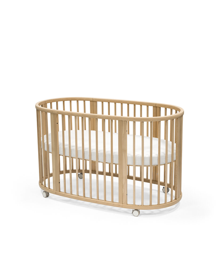 Stokke® Sleepi™ Bed, Natural. With Mattress Fitted Sheet White. galery image 2