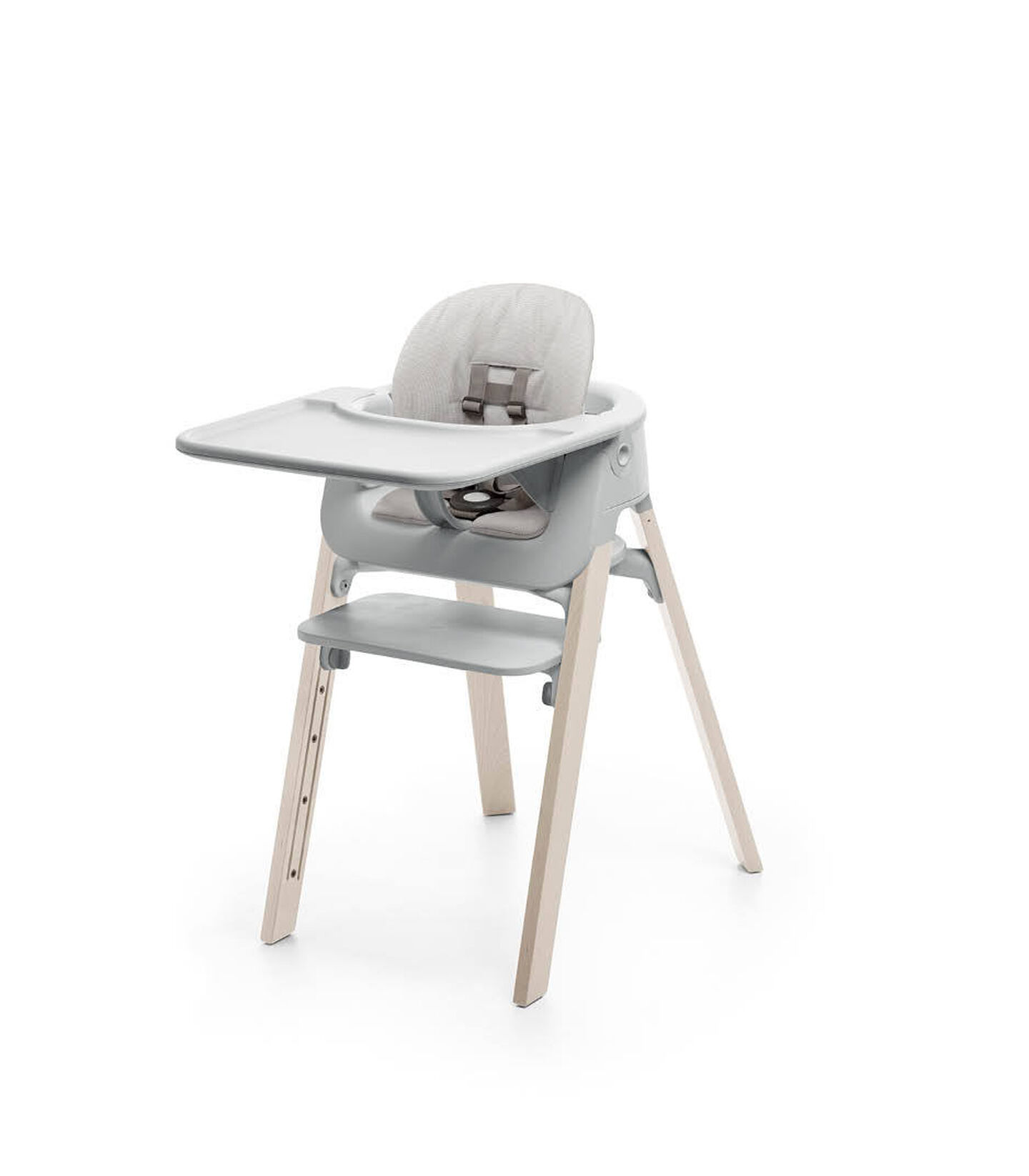 Stokke&reg; Steps&trade; Whitewash with Accessories. Baby Set Light Grey. Baby Set Cushion Timeless Grey. Baby Set Tray Light Grey.