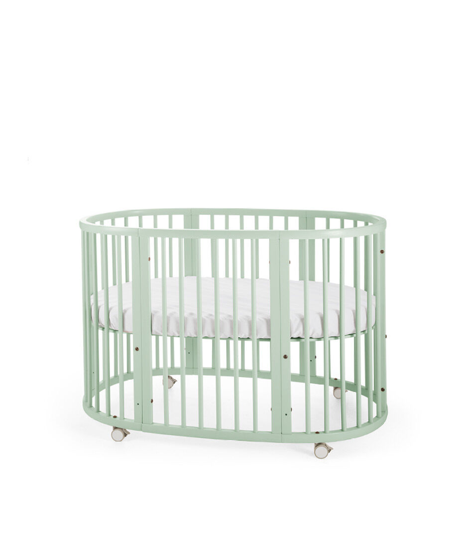 white crib and changing table set