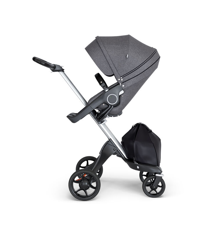 Stokke® Xplory® wtih Silver Chassis and Leatherette Black handle. Stokke® Stroller Seat Black Melange. view 1
