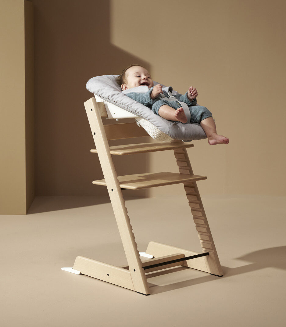 Tripp Trapp® Chair Natural with Newborn Set, Grey textiles.