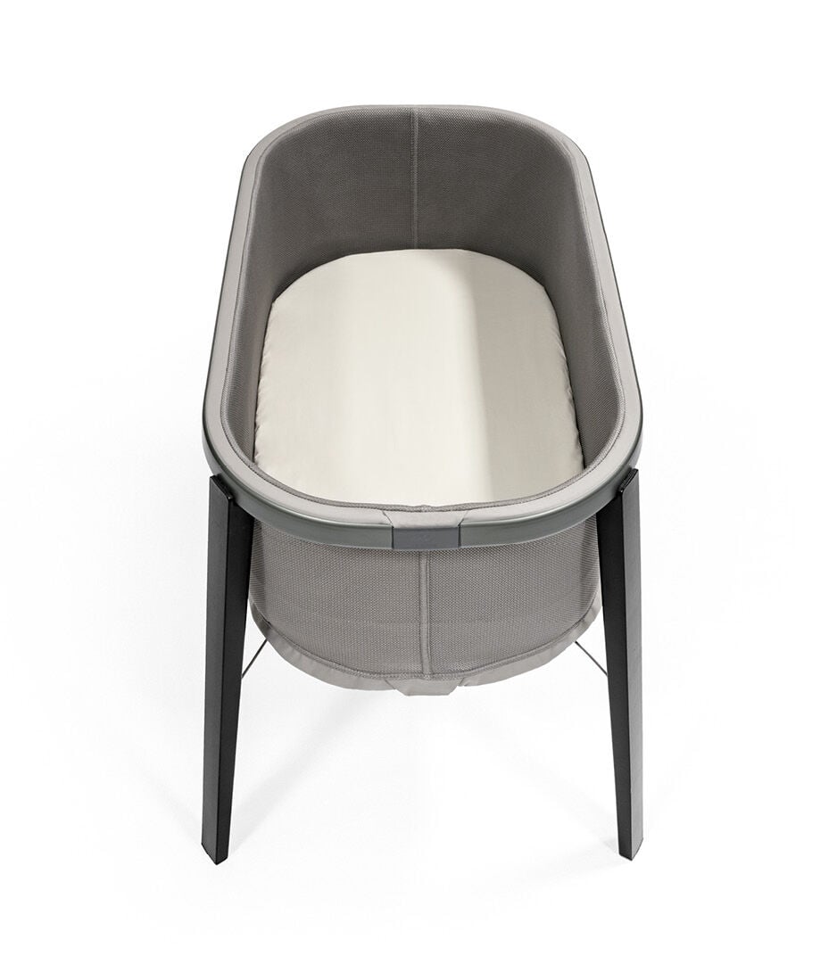 Stokke® Snoozi™ Graphite Grey with Fitted Sheet Vanilla Cream. Top view. galery image 9
