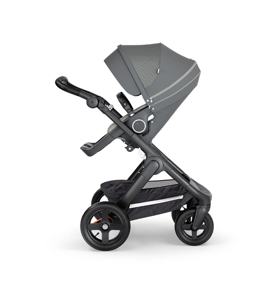 Stokke&reg; Trailz&trade; with Black Chassis, Black Leatherette and Terrain Wheels. Stokke&reg; Stroller Seat, Athleisure Green.