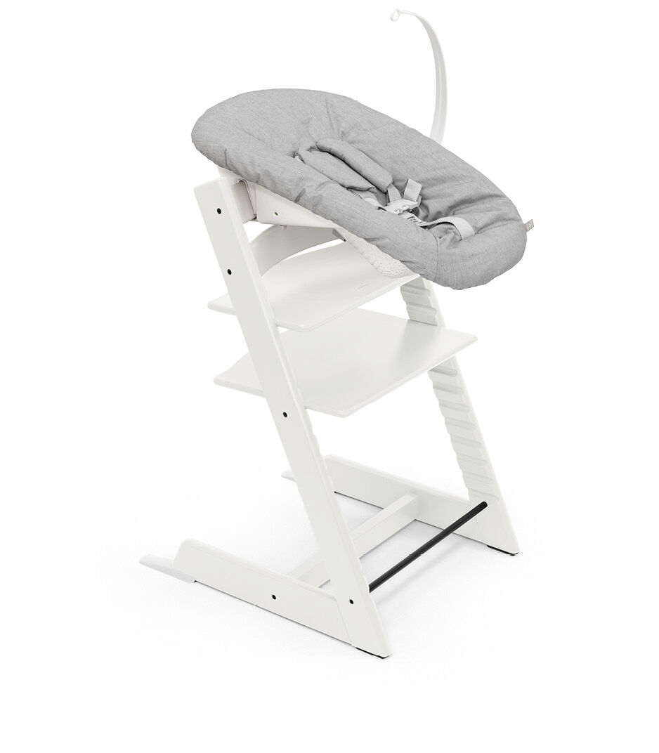 Tripp Trapp® chair White, Beech Wood, with Newborn Set Grey. Active.