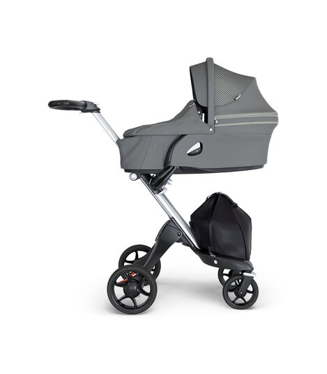 Stokke® Xplory® wtih Silver Chassis and Leatherette Black handle. Stokke® Stroller Carry Cot Athleisure Green. view 2