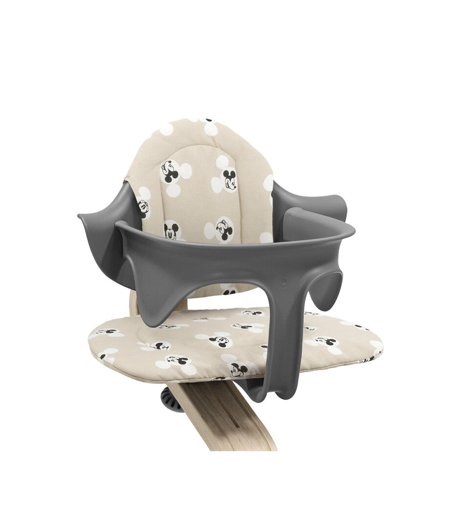 Stokke® Nomi® Chair Natural-Grey with Baby Set and Disney Cushion Mickey Signature. Close-up. Limited Edition. galery image 3