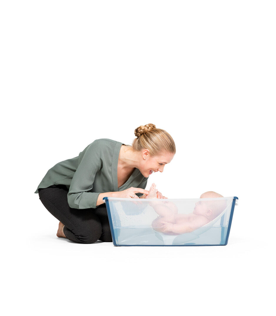 Transparent Blue Stokke Flexibath with Newborn Support Baby Bath with Heat Sensitive Drain Plug & Multicolored Baby Bath Toy Cups 