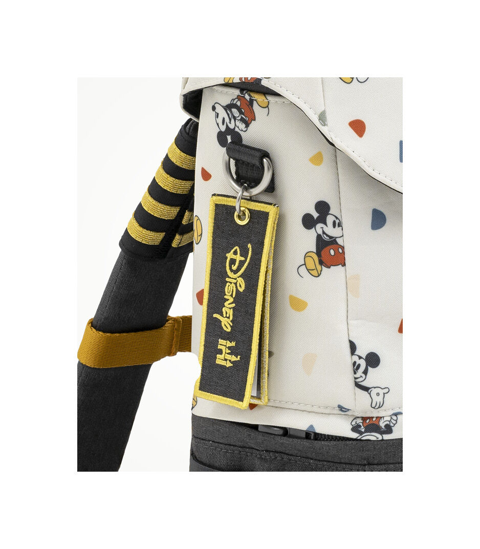 JetKids™ by Stokke® Crew BackPack. Name tag detail. Angled View. Disney Celebration Limited Edition.