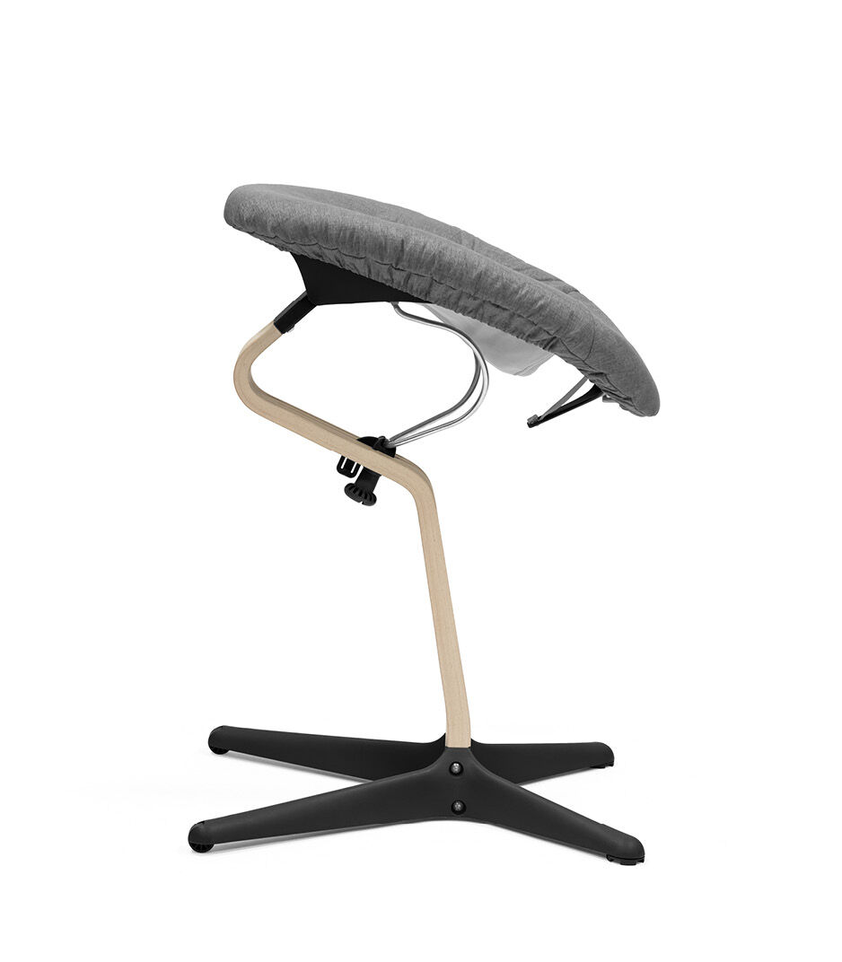Stokke® Nomi® Chair Natural-Black with Newborn Set Black and Grey textile set. Active position