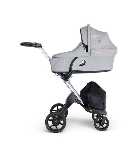 Stokke® Xplory® wtih Silver Chassis and Leatherette Brown handle. Stokke® Stroller Carry Cot Athleisure Pink. view 2