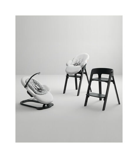 Stokke® Steps™ Bouncer with Grey Clouds textiles and highchair with Beech Black wood legs, Black seats. view 9