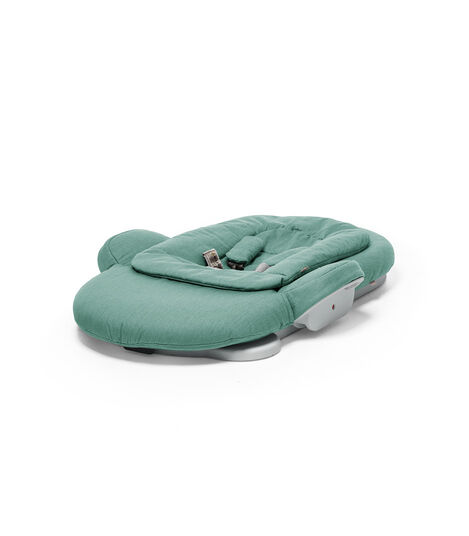 Stokke&reg; Steps Bouncer in Cool Jade. Folded.