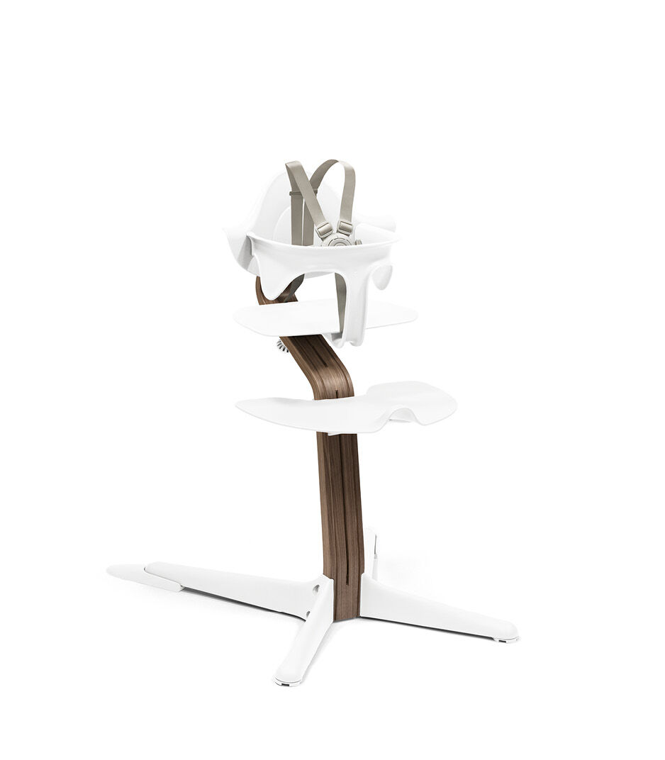 Stokke® Nomi® Chair. Premium Walnut wood and White plastic parts. With Baby Set White. US variant w/Harness.