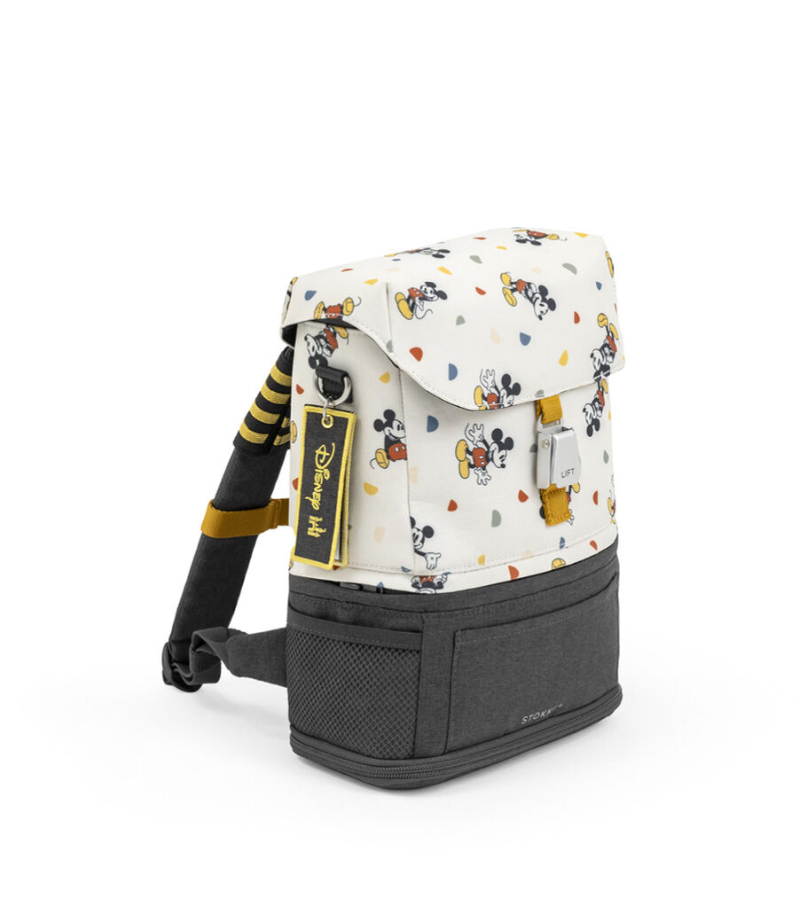 JetKids™ by Stokke® Crew BackPack. Angled View. Disney Celebration Limited Edition. view 1