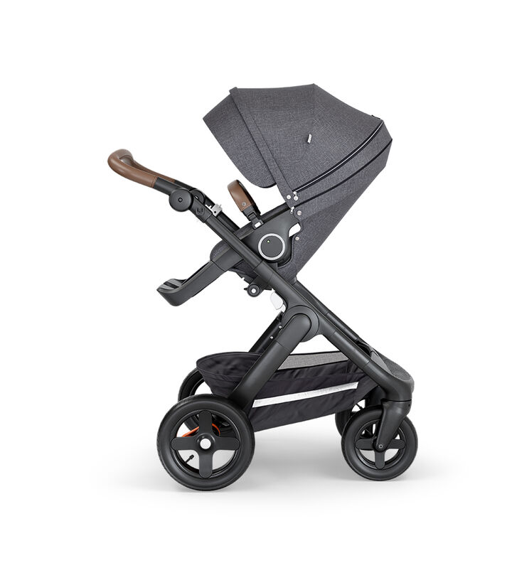 Stokke&reg; Trailz&trade; with Black Chassis, Brown Leatherette and Terrain Wheels. Stokke&reg; Stroller Seat, Black Melange.