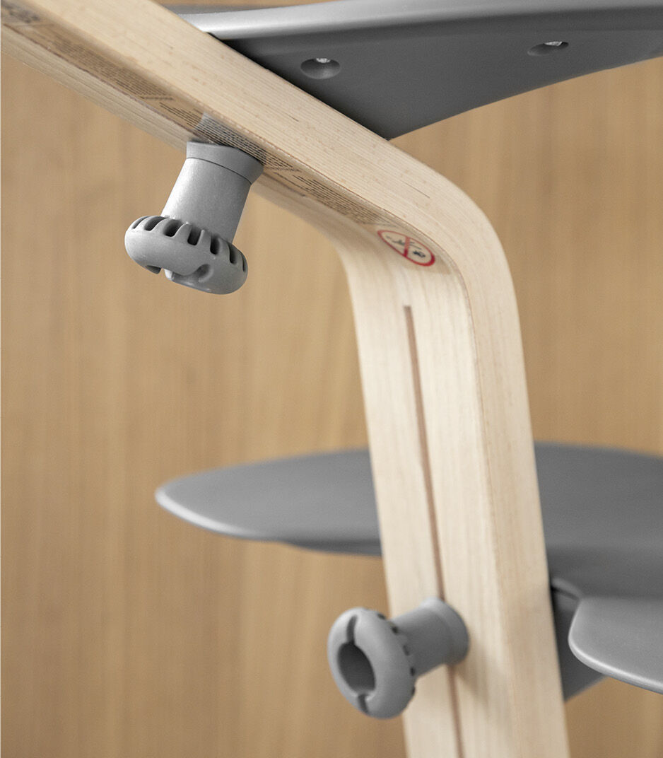Stokke® Nomi® Chair. Natural/Grey. Seat and Foot plate adjustment skcrew.