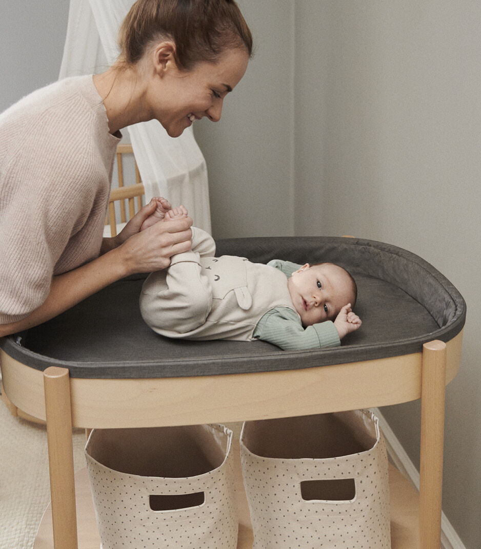 Stokke® Sleepi™ Changing Table, Natural. Emotional close-up. galery image 2