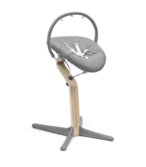 Stokke® Nomi® Chair Natural-Grey with Newborn Set Grey. Nomi Play attached. view 3