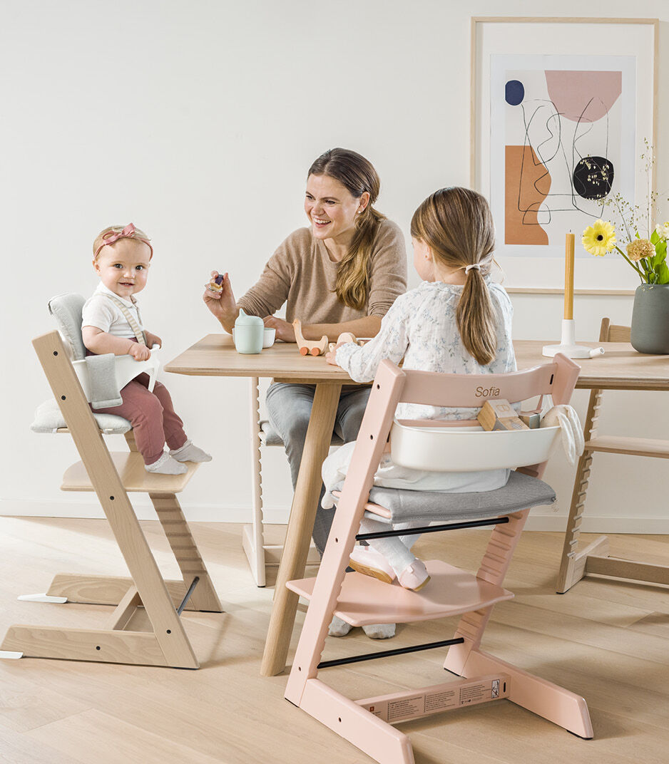 Tripp Trapp® Oak Natural, Serene Pink and Natural. Hazy Grey Baby Set and Timeless Grey Baby Cushion. Storage White. Stokke Munch.