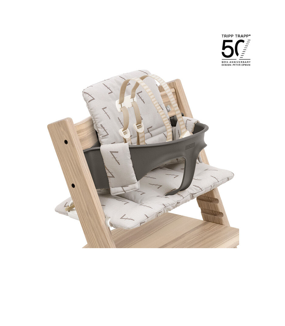 Tripp Trapp® Limited Edition Ash Mixed with Baby Set White and Classic Cushion Icon Grey. US version with Harness. Close-up.