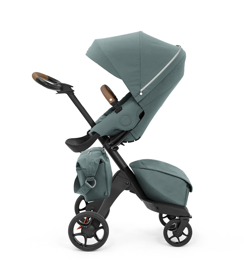 Stokke® Xplory® X Changing Bag Cool Teal on the stroller. Seat.