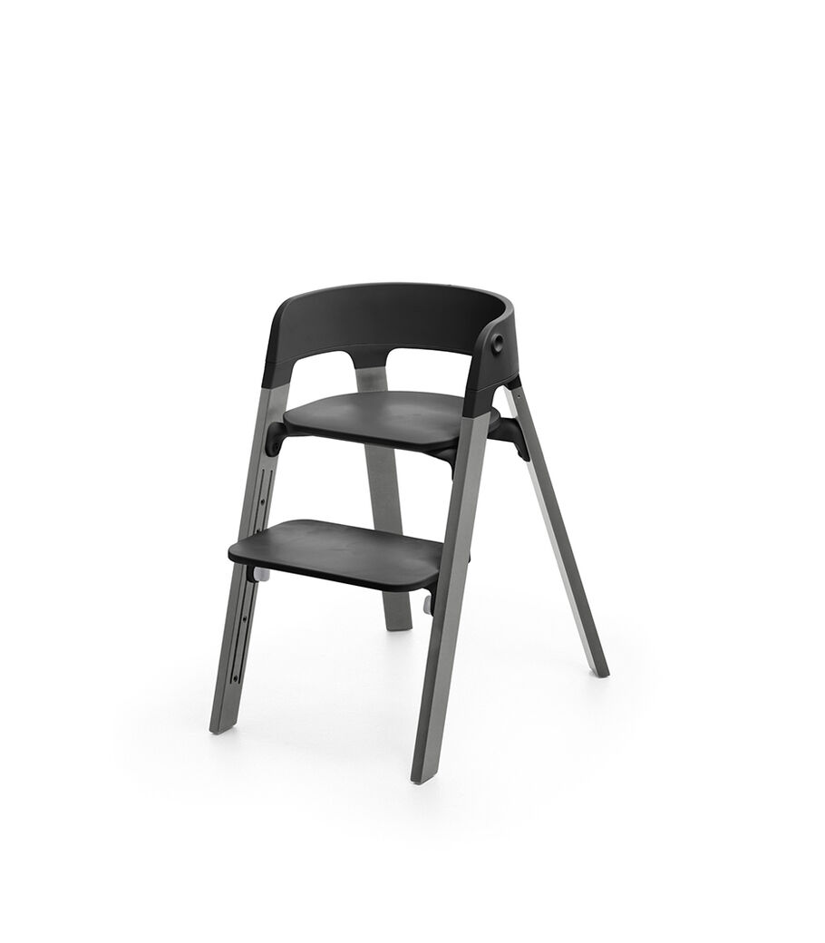 Stokke&reg; Steps&trade; Storm Grey  with Black seat and footrest in high position.