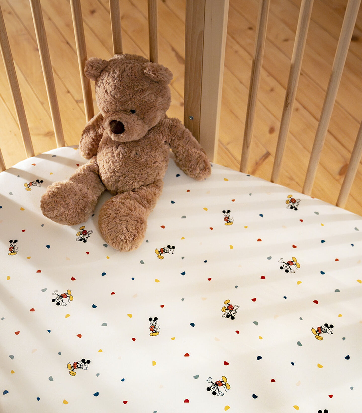 Stokke® Slepi® Bed, Natural. Disney Mickey Celebration Fitted Sheets. Close-up. view 2