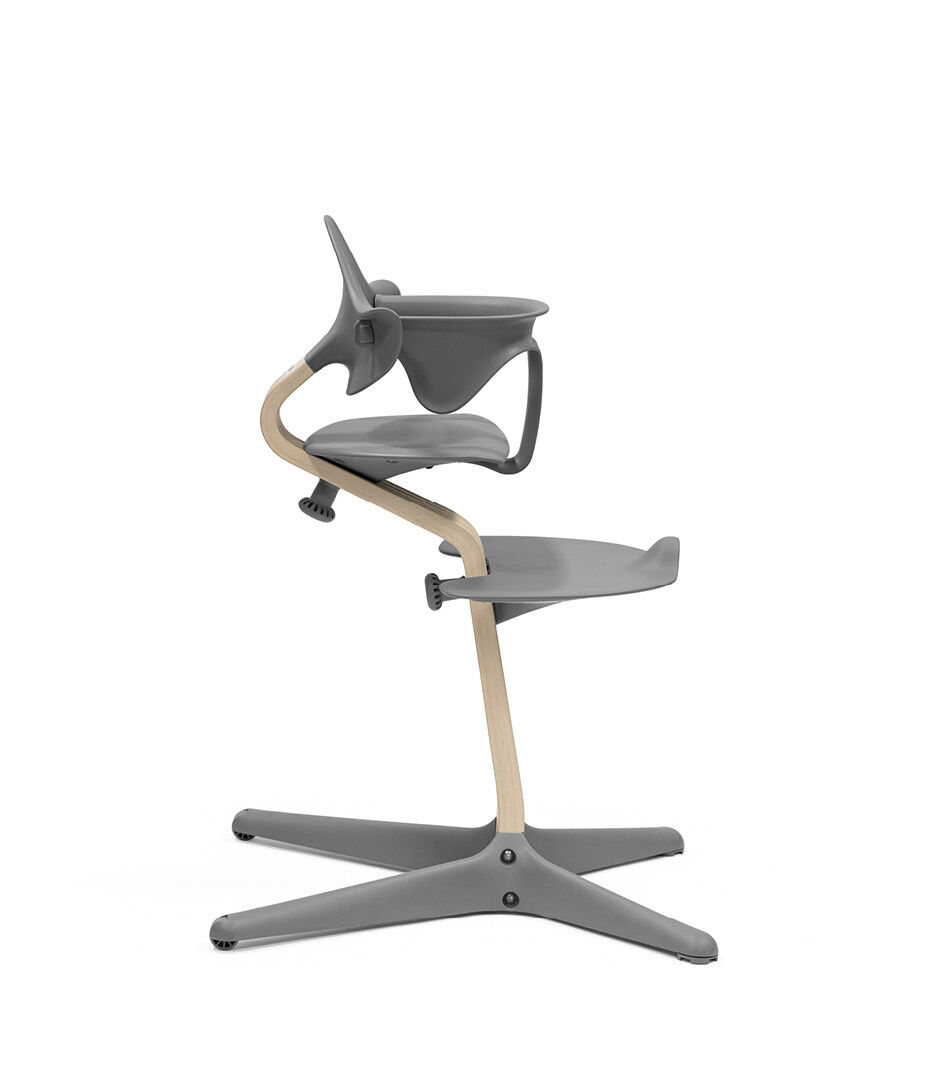 Stokke® Nomi® Chair Natural-Grey with Baby Set. Silhouette view.