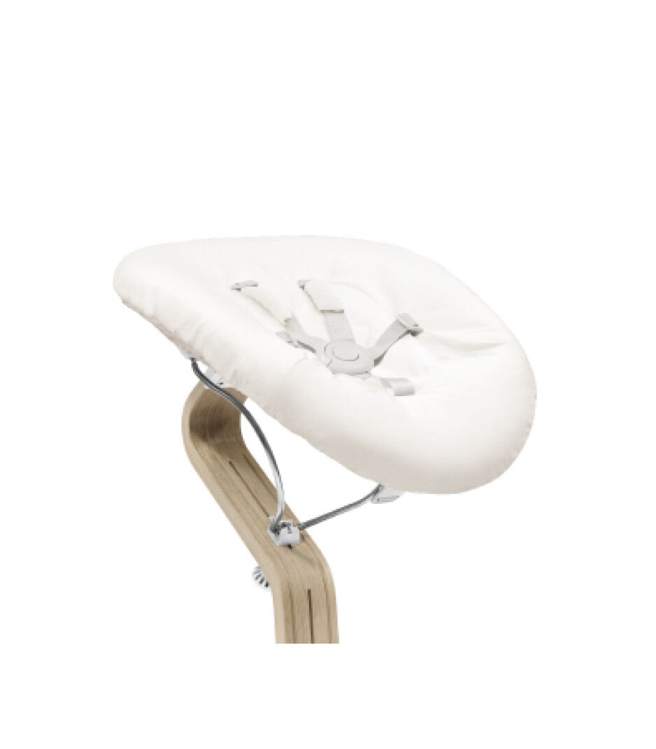 Stokke® Nomi® Chair Natural-White with Newborn Set Sand V1. Close-up.