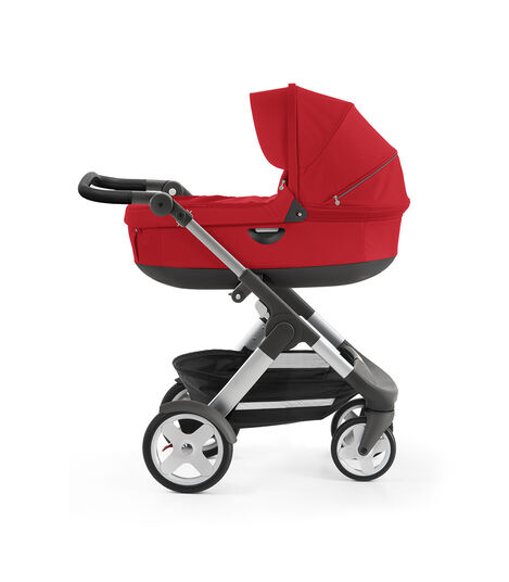 Stokke® Trailz™ with silver chassis and Stokke® Stroller Carry Cot, Red. Classic Wheels. view 2
