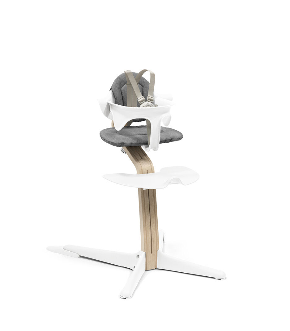 Stokke® Nomi® Chair. Premium Oak wood and White plastic parts. With Baby Set White and Cushion Grey. US variant w/Harness.