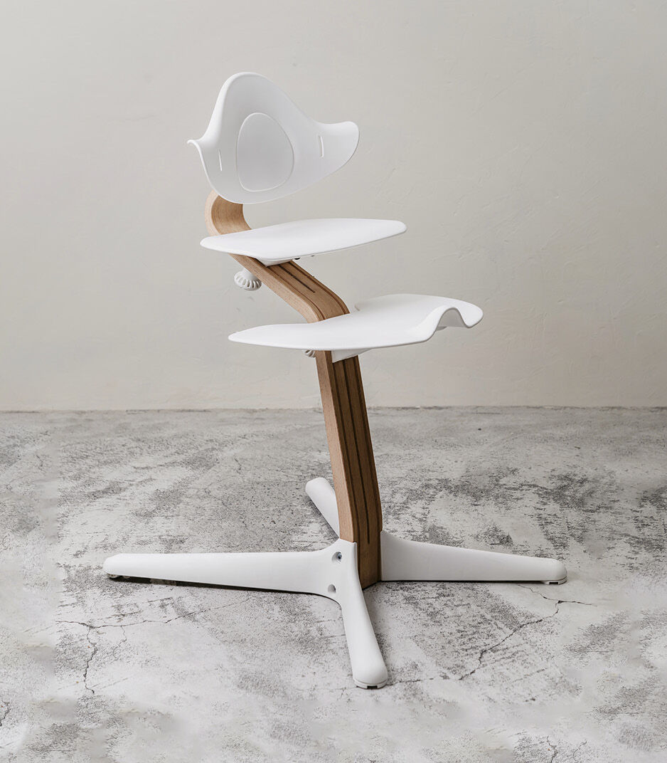 Stokke® Nomi® Chair. Oak premium wood and White plastic parts. Styled. galery image 4