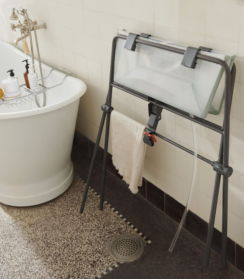 Stokke® FlexiBath® Transparent Green in Stokke® FlexiBath® Stand, folded. galery image 5