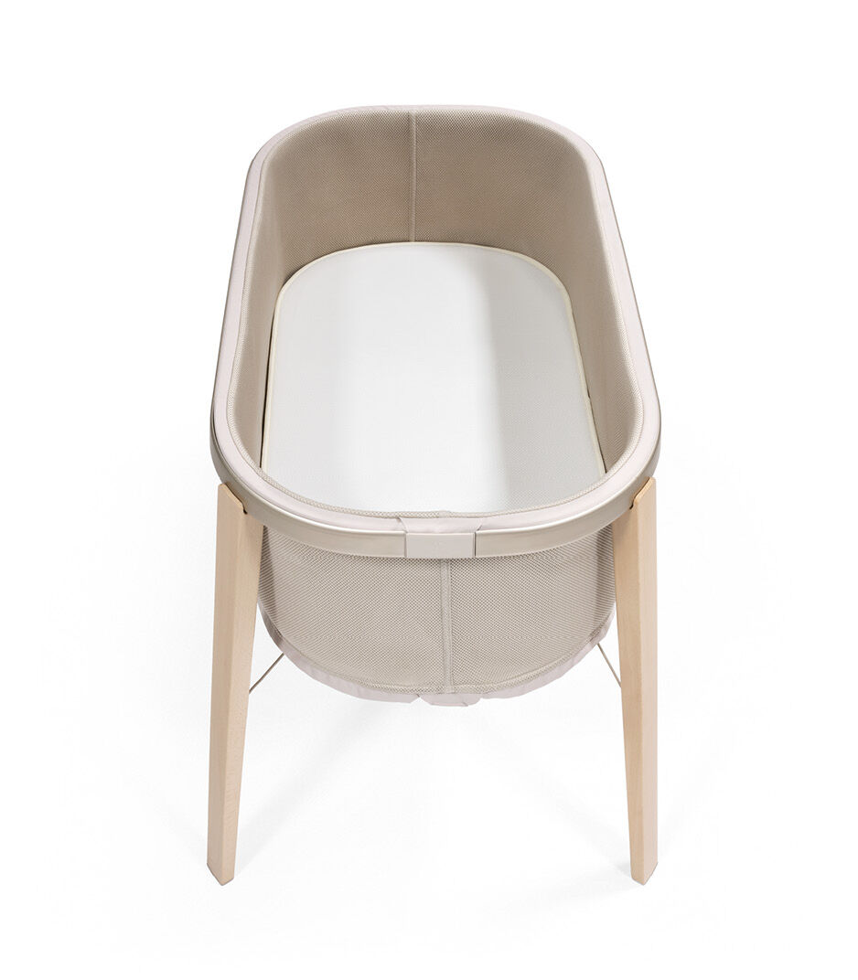 Stokke® Snoozi™ Sandy Beige with Protection Sheet Vanilla Cream. Top view.