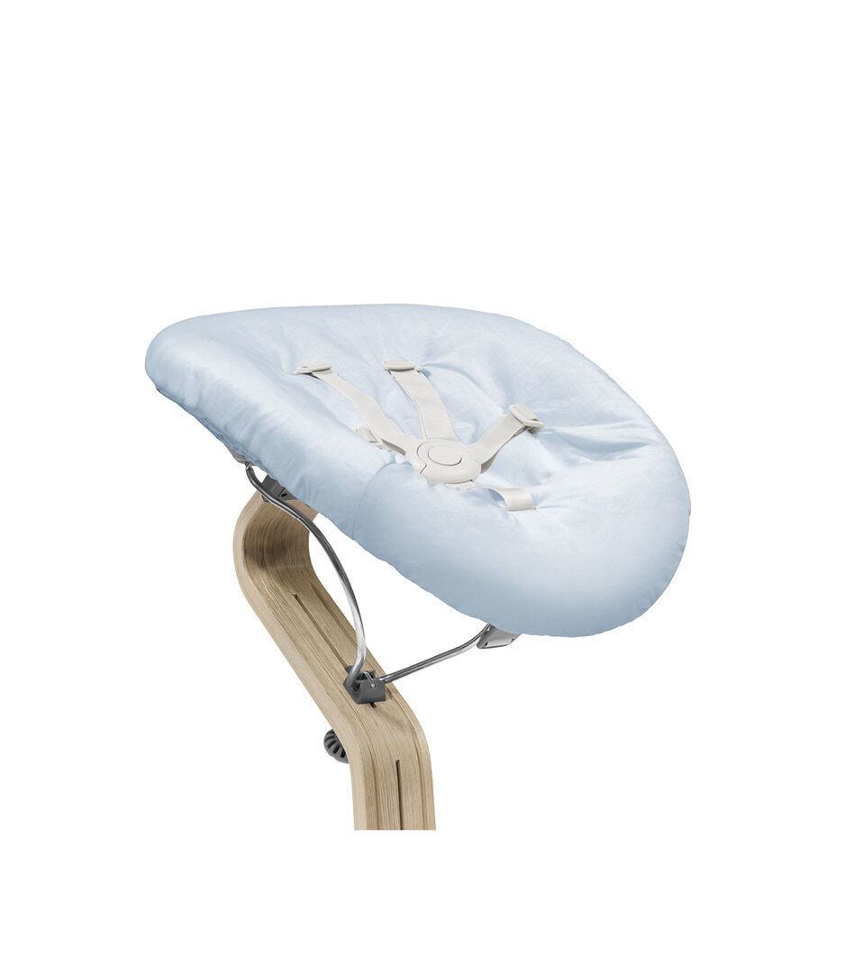 Stokke® Nomi® Chair Natural-Grey with Newborn Set Blue. Close-up.