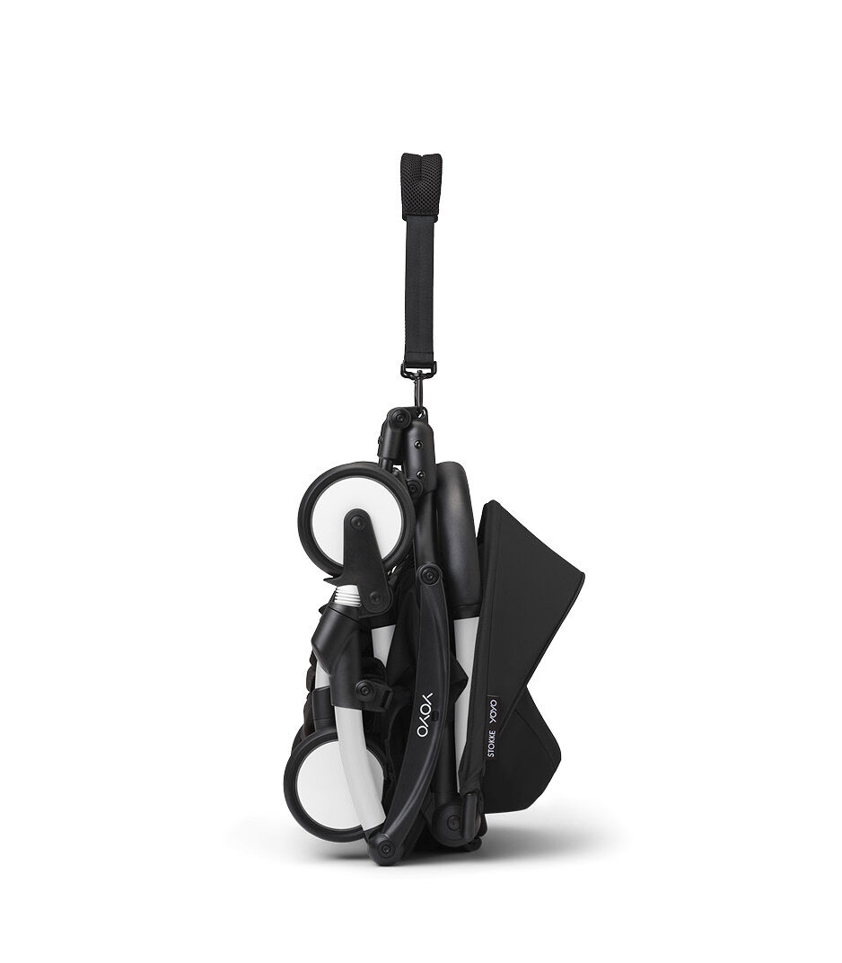 Stokke® YOYO3® 6+ Black. White Frame. Folded, vertical.