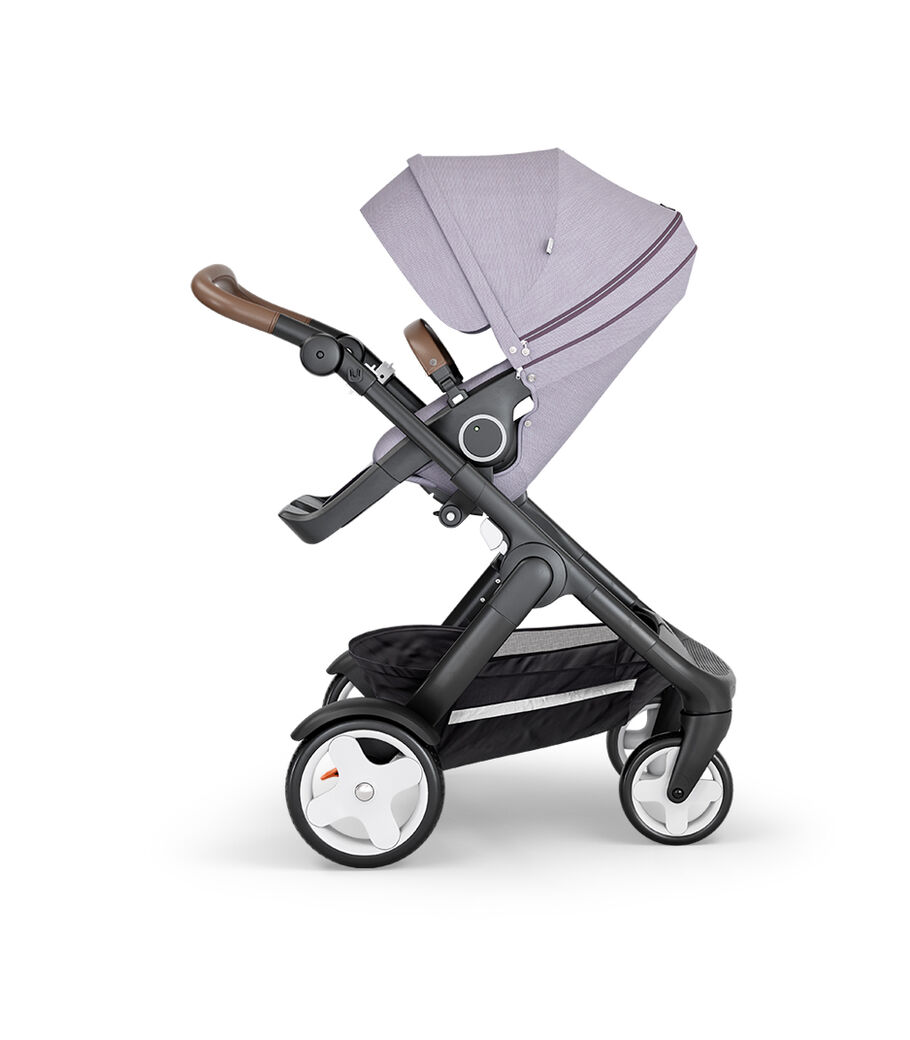 Stokke&reg; Trailz&trade; with Black Chassis, Brown Leatherette and Classic Wheels. Stokke&reg; Stroller Seat, Brushed Lilac.