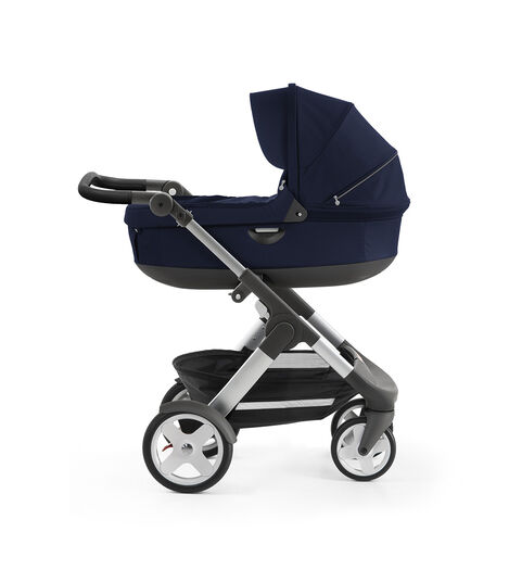 Stokke® Trailz™ with silver chassis and Stokke® Stroller Carry Cot, Deep Blue. Classic Wheels. view 2