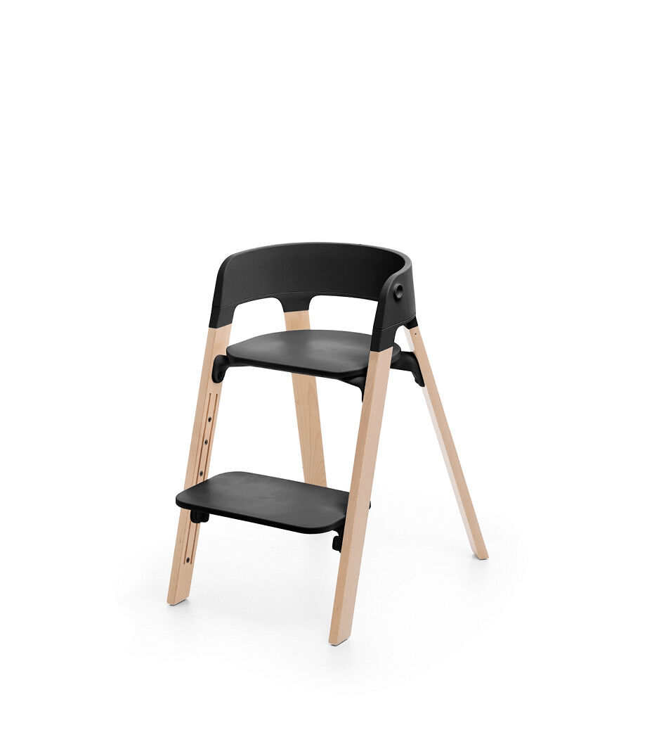Stokke® Steps™ Chair, Beech Natural with Black Seat. Footrest low.