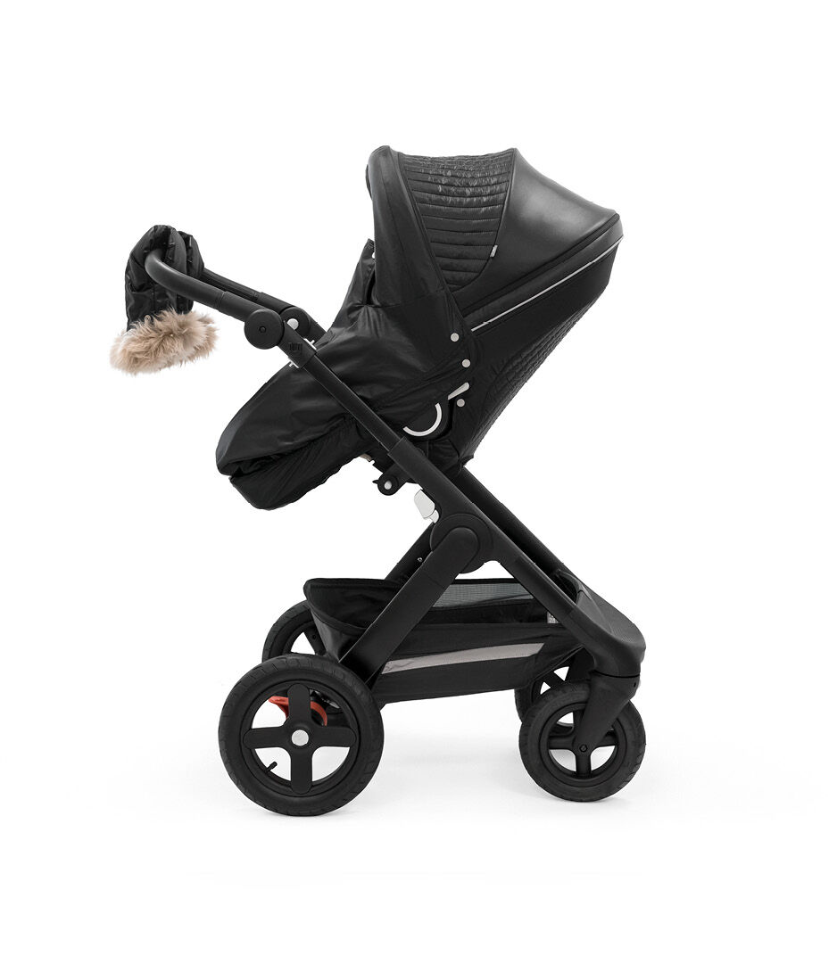 Stokke® Trailz™ Black Chassis with Stokke® Stroller Seat and Onyx Black Winter Kit.