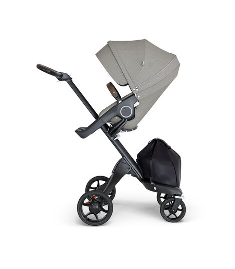 Stokke® Xplory® wtih Black Chassis and Leatherette Brown handle. Stokke® Stroller Seat Seat Brushed Grey. view 2