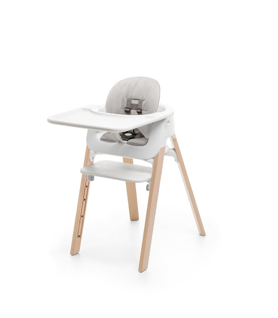 Stokke® Steps™ Chair Natural. Baby Set White. Cushion Timeless Grey. Baby Set Tray White.