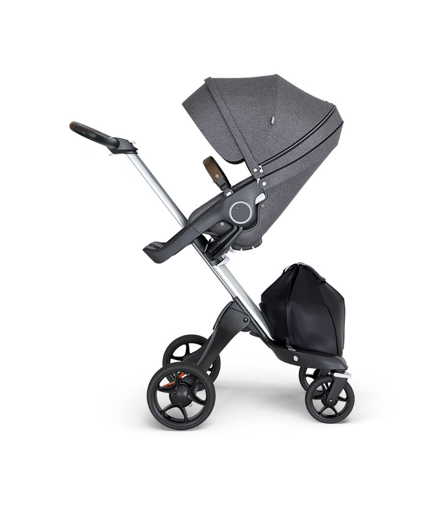 Stokke® Xplory® wtih Silver Chassis and Leatherette Brown handle. Stokke® Stroller Seat Black Melange. view 12