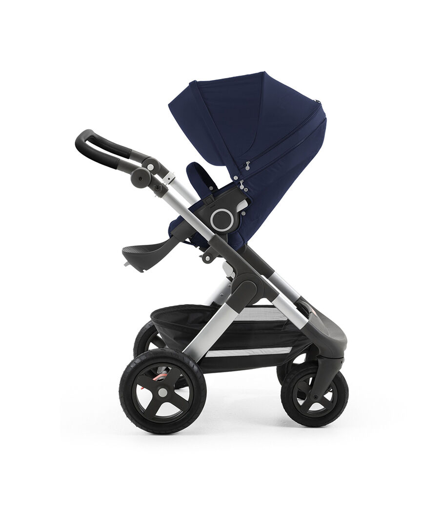Stokke® Trailz™ with silver chassis and Stokke® Stroller Seat, Deep Blue. Leatherette Handle. Terrain Wheels. view 37