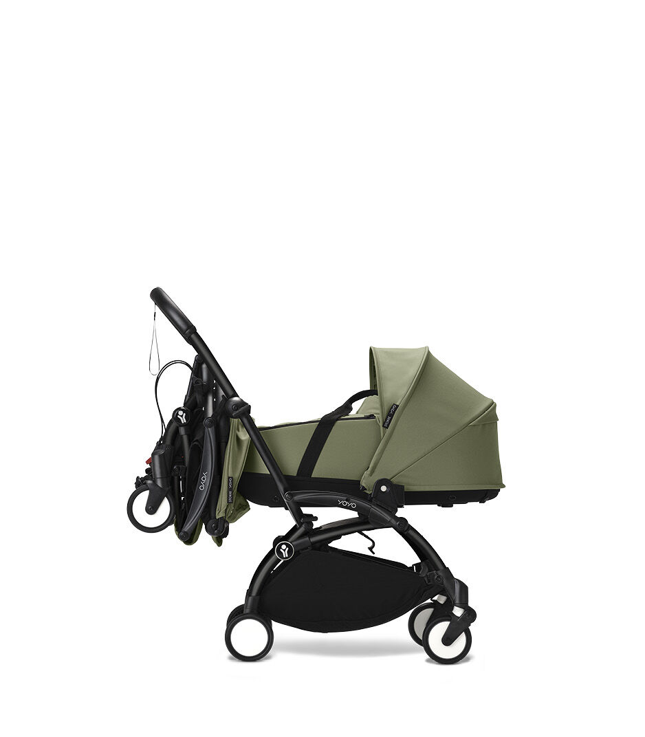 Stokke® YOYO3® Newborn Shell. Black Frame. Olive. Connect folded.
