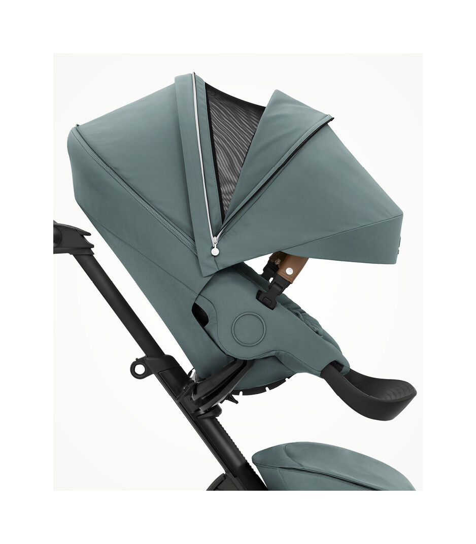Stokke® Xplory® X Cool Teal. Seat, forward facing with extended canopy. Ventilation open.