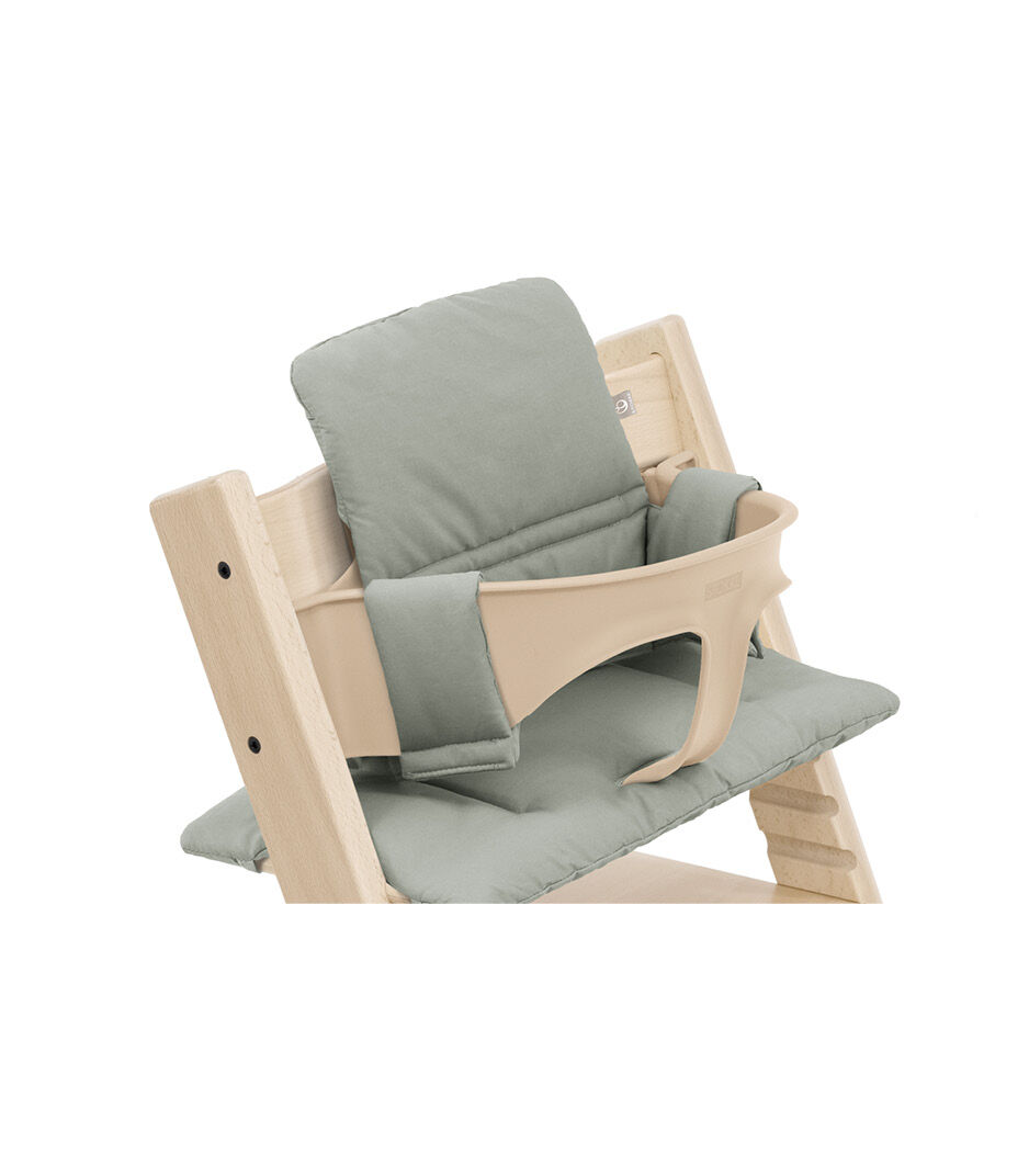Tripp Trapp® chair Natural with Baby Set and Classic Cushion Glacier Green. Close-up.