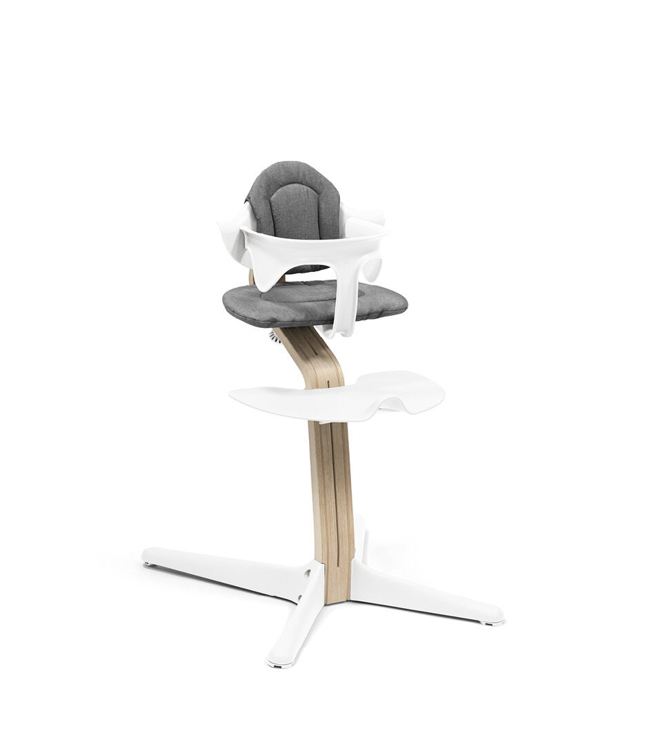 Stokke® Nomi® Chair Natural-White with Baby Set and Grey Cushions.