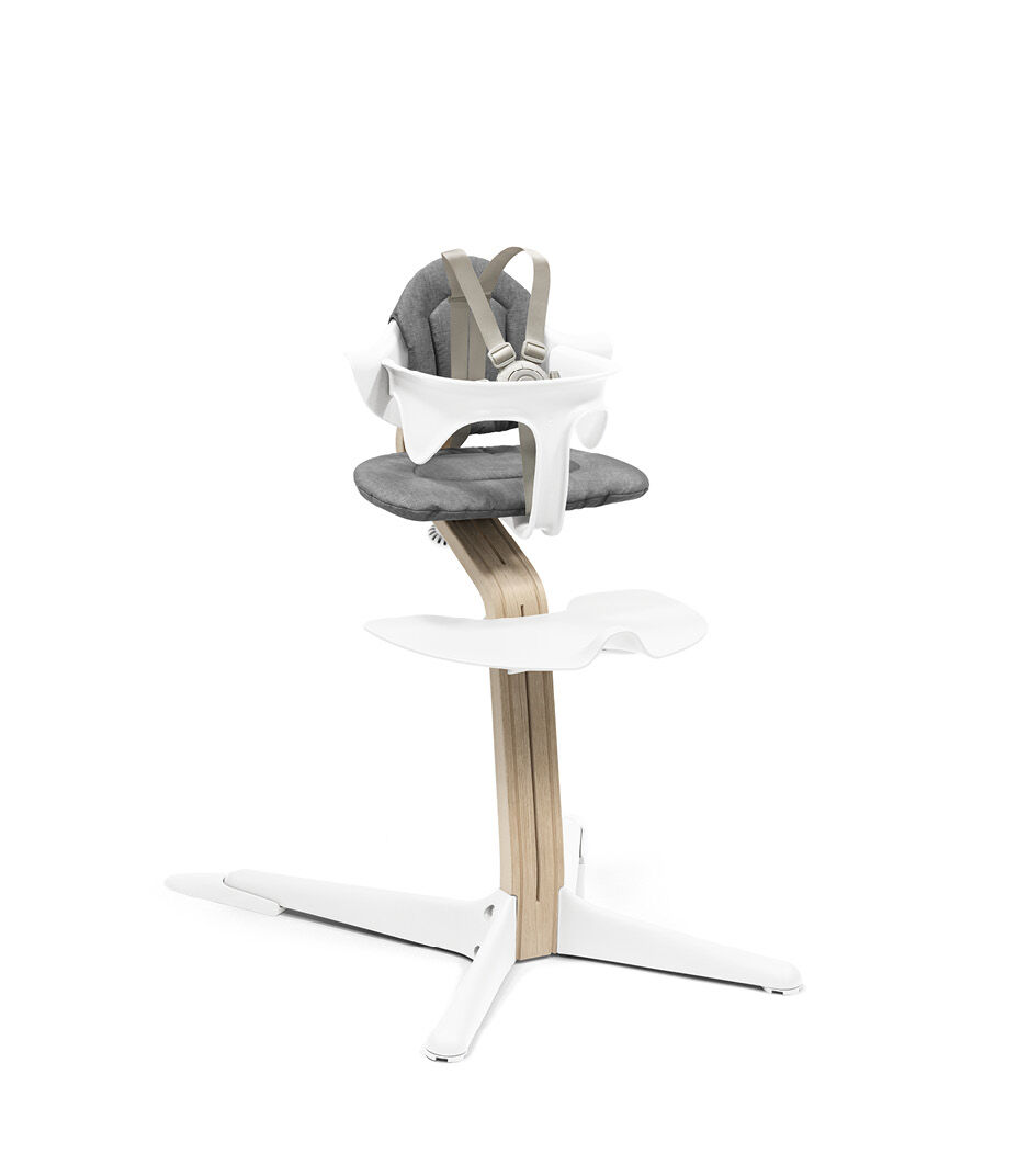Stokke® Nomi® Chair. Premium Oak wood and White plastic parts. With Baby Set White and Cushion Grey. US variant w/Harness. galery image 6